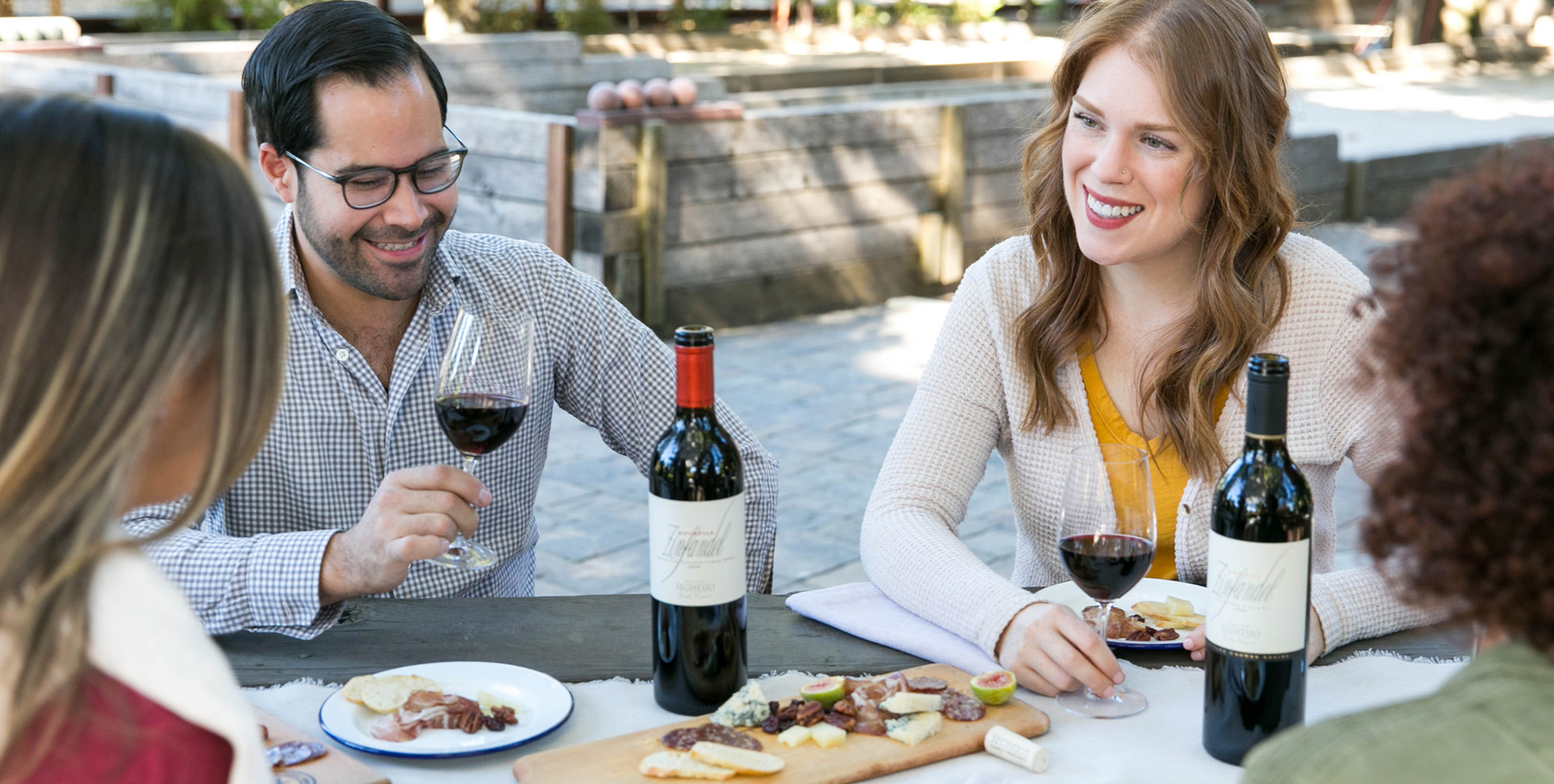 Group enjoying picnic and wine at Seghesio Family Vineyards