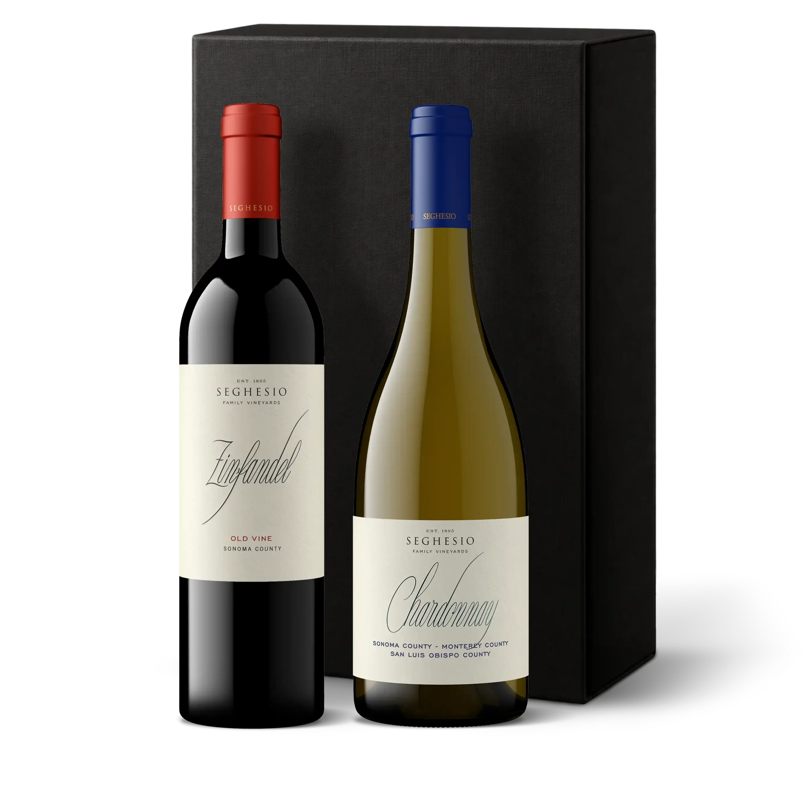 Two wine bottles, one red with a red cap labeled Zinfandel and one white with a blue cap labeled Chardonnay, stand in front of a plain black gift box—perfectly embodying the Premiere Sonoma Zinfandels 2-Bottle Gift.