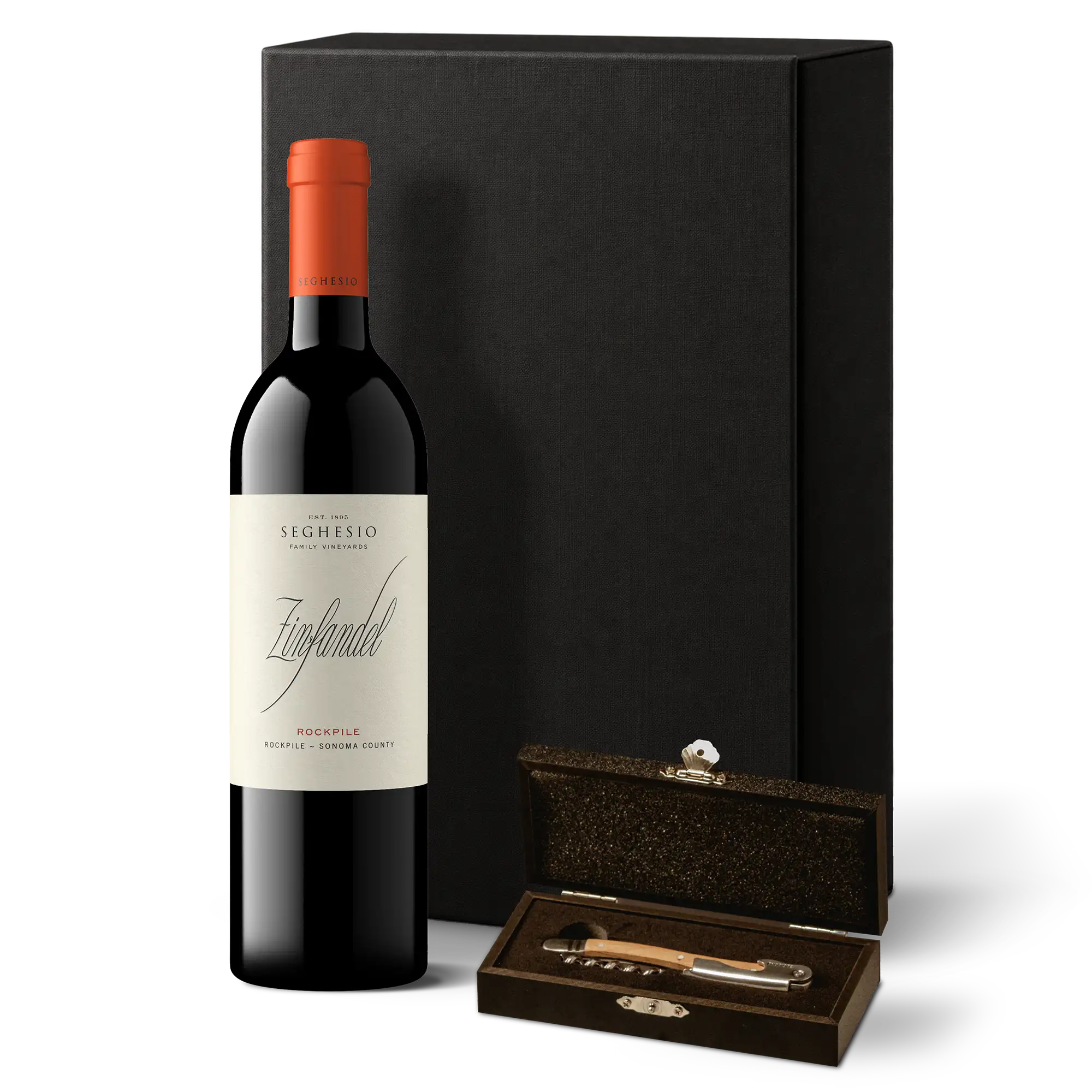 A bottle of Seghesio Zinfandel wine stands next to a black gift box and an open brown box containing a corkscrew and bottle stopper—together, this elegant arrangement forms the Rockpile & Corkpull Gift Set.