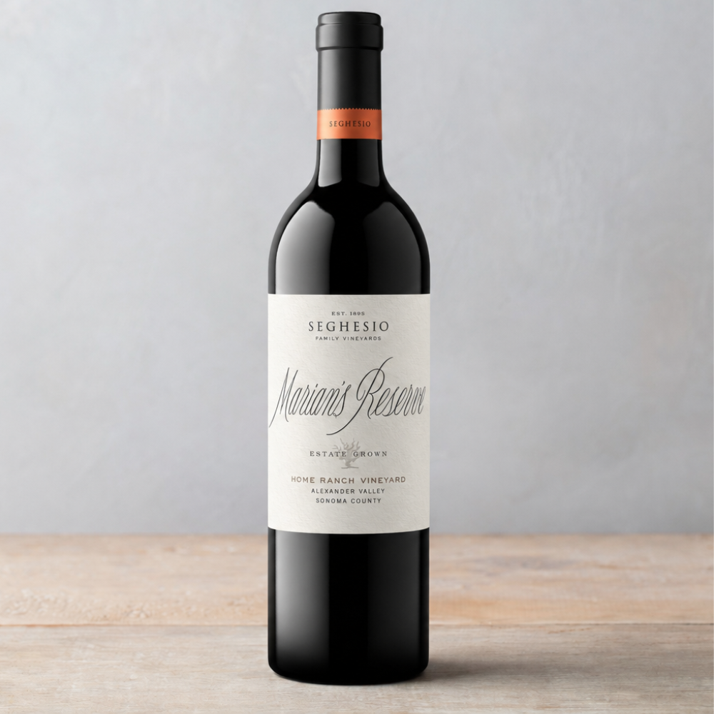 A bottle of Seghesio Family Vineyards Marians Reserve red wine stands on a wooden surface against a light gray background.