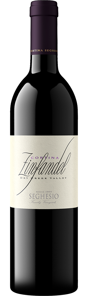 A bottle of Cortina Zinfandel by Seghesio features a dark glass body, deep purple foil on the neck, and a cream-colored label elegantly displaying the Cortina Zinfandel name and winery details in graceful script.